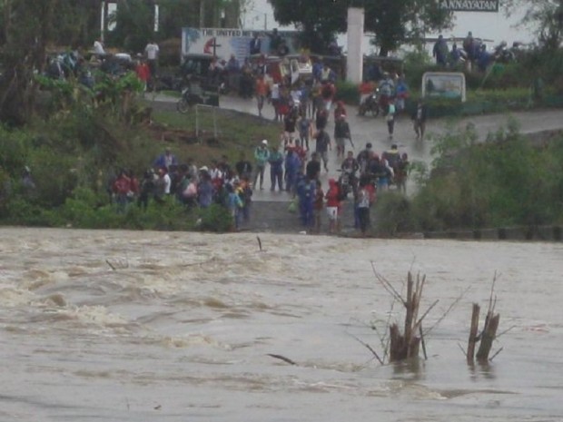 In this Radyo Inquirer file photo courtesy of the Baggao Police in Cagayan province, a river swells amid heavy rains. 