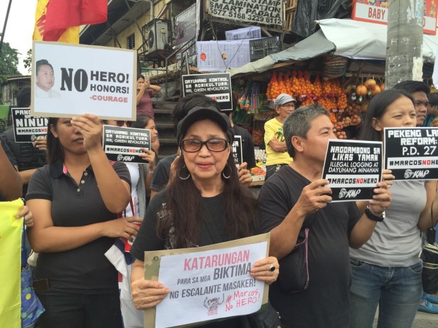 People opposing the burial of former president Ferdinand Marcos hold a rally at Philcoa in Quezon City. Photo by Joan Bondoc/INQUIRER