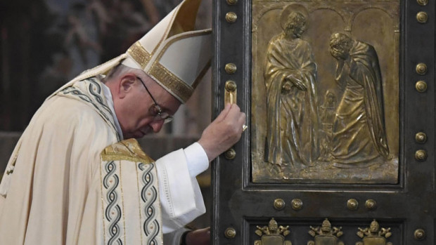 Pope Francis closes the Holy Door of St. Peter's Basilica at the Vatican, Sunday, Nov. 20, 2016 marking the end of the Jubilee of Mercy. (Tiziana Fabi/pool photo via AP)