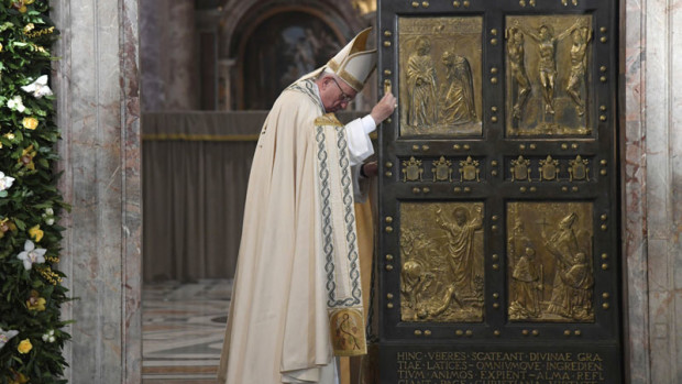 Pope Francis closes the Holy Door of St. Peter's Basilica at the Vatican, Sunday, Nov. 20, 2016. Pope Francis has pulled shut the Holy Door of St. Peter’s Basilica, formally ending the Holy Year of Mercy he declared to highlight that virtue. (Tiziana Fabi/pool photo via AP)