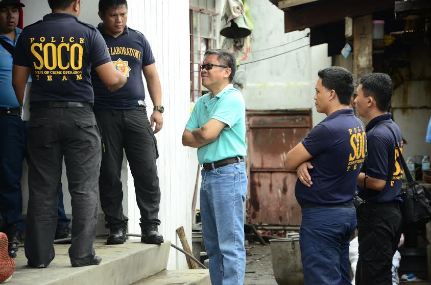 Members of the Scene of the Crime Operatives stand outside the jail cell of slain Albuera, Leyte Mayor Rolando Espinosa Sr. on Nov. 5, 2016, as they wait for further instructions. (PHOTO BY ROBERT DEJON/  INQUIRER VISAYAS)