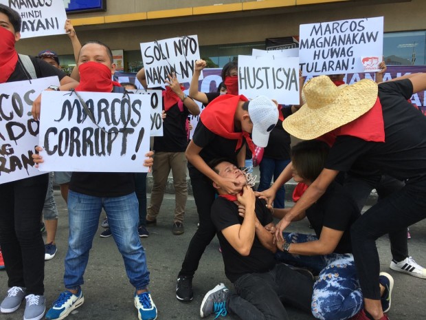 Members of the UP Samasa Alumni and Volunteers Coalition AGainst Marcos Burial in Libingan ng mga Bayani do the mannequin challenge in Quezon City to drum up support for their cause. CONTRIBUTED PHOTO