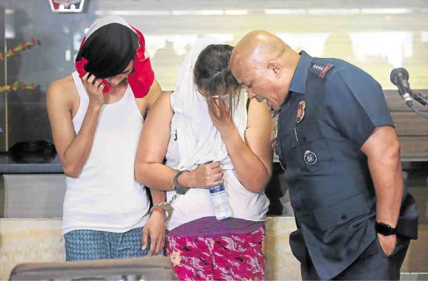 PNP chief Ronald dela Rosa tries to get answers from drug suspects Ma. Rosario Echaluce and Angelo Echaluce following their arrest. —GRIG C. MONTEGRANDE