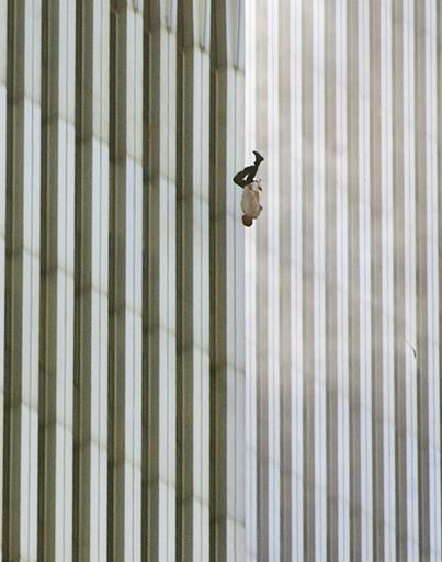 FILE - In this Tuesday, Sept. 11, 2001 file picture, a person falls headfirst from the north tower of New York's World Trade Center. This iconic image is included in Time magazine's most influential images of all time, released Thursday, Nov. 17, 2016, through a new book, videos and a website, Time.com/100photos.  (AP Photo/Richard Drew, File)