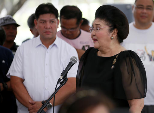 Imelda Marcos, widow of the late Philippine dictator Ferdinand Marcos, addresses hundreds of supporters following a mass at his graveyard Saturday, Nov. 19, 2016, a day after Marcos was buried in a secrecy-shrouded ceremony at the Heroes' Cemetery in suburban Taguig city, east of Manila, Philippines. Long-dead Marcos was buried Friday at the country's Heroes' Cemetery in a secrecy-shrouded ceremony, a move approved by President Rodrigo Duterte that infuriated supporters of the "people power" revolt that ousted Marcos three decades ago. AP Photo