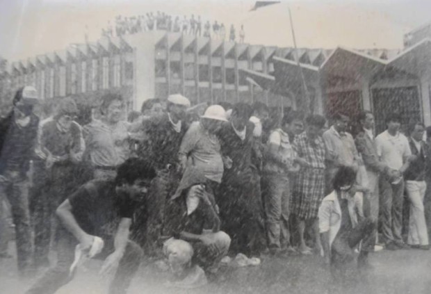 Protesters stand their ground amid the use of water cannons during a rally at Welcome Rotunda on September 27, 1984. Photo courtesy of Lito Ocampo.