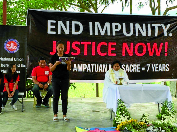 CALL FOR JUSTICE Relatives of victims of the 2009 Maguindanao massacre led by Fr. Rey Carvyn Ondap, executive director of Passionist Center for Justice, Peace and Integrity of Creation in the Philippines, blame the judiciary for allowing the culprits to mock the law, thus delaying the delivery of justice, in amemorialMass. —JULIE S. ALIPALA