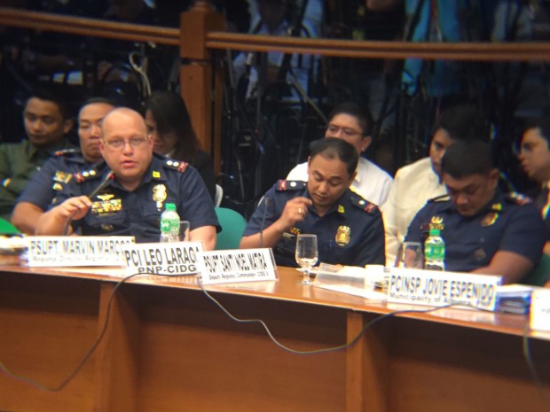 Policemen, from left, led by Supt. Marvin Marcos, Chief Insp. Leo Laraga and Supt. Santi Noel Matira testify before the Senate investigation on the death of Albuera, Leyte, Mayor Rolando Espinosa. NOY MORCOSO / INQUIRER.net
