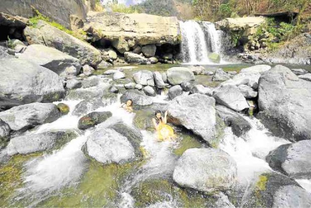 NATURE’S TREAT A dip in Maranum Falls soothes weary visitors in Natividad town. In Balungao, a 1.4-kilometer zipline gives the adventurous a view of eastern Pangasinan’s verdant fields and mountains. —PHOTOS BY WILLIE LOMIBAO