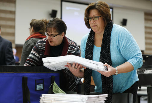 Holly Brandt, clerk of Milford Township, stacks ballots during a statewide presidential election recount in Waterford Township, Mich., Monday, Dec. 5, 2016. The recount comes at the request of Green Party candidate Jill Stein, who also requested recounts in Pennsylvania and Wisconsin.  AP 