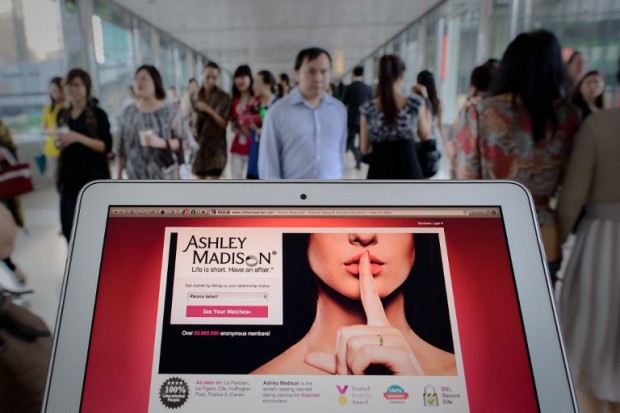 FILES) This file illustration taken on August 20, 2013 shows the homepage of the Ashley Madison dating website displayed on a laptop in Hong Kong. The operators of the Ashley Madison affair-minded dating website agreed on December 14, 2016 to pay a $1.6 million penalty over a data breach exposing data from 36 million users, US officials announced. Ashley Madison's Canadian parent company Ruby agreed to the penalty to settle charges with the US Federal Trade Commission and state regulators for failing to protect confidential user information.  / AFP PHOTO / PHILIPPE LOPEZ