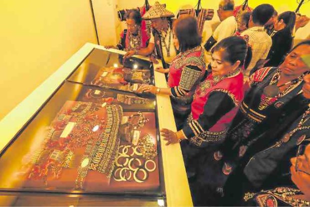 Subangan symbolizes Davao Oriental’s drive to set itself apart as a prime tourism destination in the region. At right, Rep. Corazon Malanyaon, a former governor, views a showcase of ornaments and traditional garb of the Mandaya. —PHOTOS BY EDEN JHAN LICAYAN/ CONTRIBUTOR 