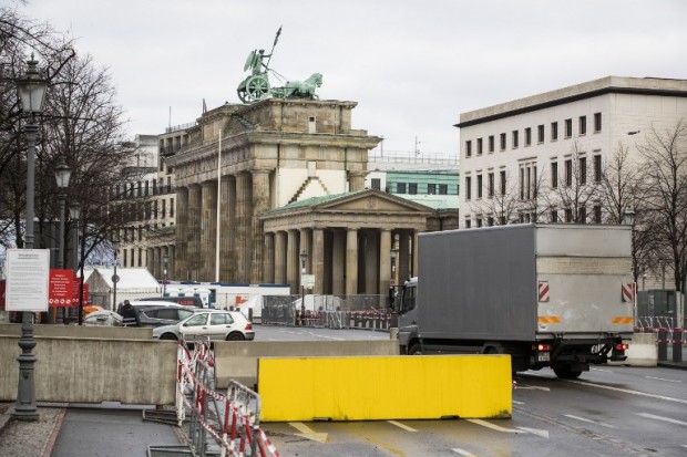 A truck is let through a concrete barrier in front of Berlin landmark Brandenburger Gate on December 29, 2016.  Security around the annual New Years celebration in Berlin has been stepped up after an attack on a Christmas market in the German capital earlier in the month. / AFP PHOTO / Odd ANDERSEN