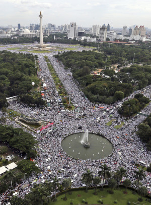This aerial view shows Indonesian Muslims fill the streets around the National Monument during a rally against Jakarta's minority Christian Governor Basuki "Ahok" Tjahaja Purnama who is being prosecuted for blasphemy, in Jakarta, Indonesia, Friday, Dec. 2, 2016. Several hundred thousands of conservative Muslims rallied in the Indonesian capital on Friday in the second major protest in a month against the minority Christian governor. (AP Photo)