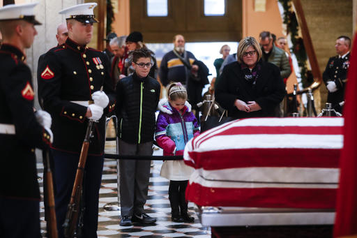 Mourners pause at the casket of John Glenn as he lies in honor, Friday, Dec. 16, 2016, in Columbus, Ohio. Glenn's home state and the nation began saying goodbye to the famed astronaut who died last week at the age of 95. AP