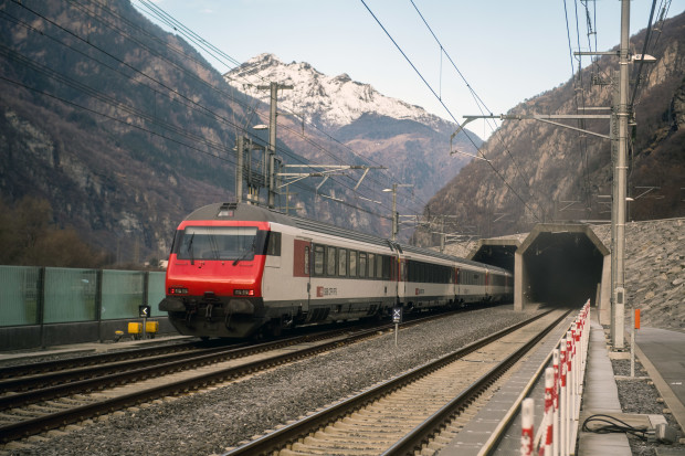 A passenger train enters the south portal of the Gotthard rail tunnel between Erstfeld and Pollegio, in Pollegio, Switzerland, Sunday, Dec.11, 2016. The construction of the 57 kilometer long tunnel began in 1999, the breakthrough was in 2010. After the official opening on June 1, the commercial operation started on Sunday.  (Samuel Golay/Keystone,Ti-Press via AP))