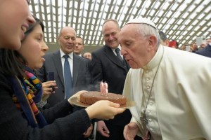 Pope Francis blows candle on cake on 80th birthday - 17 Dec 2016