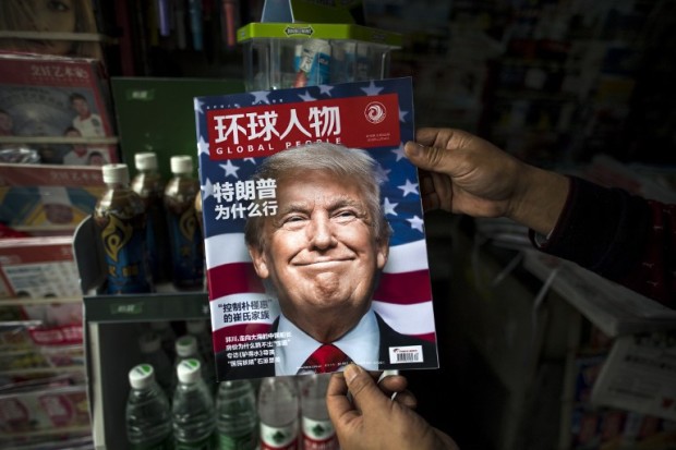 (FILES) This file photo taken on November 14, 2016 shows a copy of the local Chinese magazine Global People with a cover story that translates to "Why did Trump win" at a news stand in Shanghai.  US President-elect Donald Trump broke with decades of cautious US diplomacy on December 2 to speak with the president of Taiwan, at the risk of provoking a serious rift with China. / AFP PHOTO / JOHANNES EISELE
