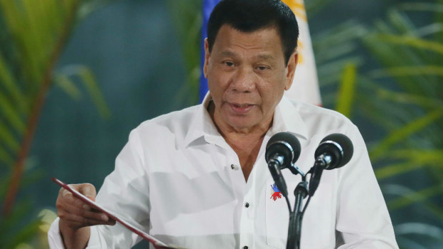 Philippine President Rodrigo Duterte delivers a statement prior to his departure for Cambodia and Singapore for official visits to the ASEAN neighbors, Tuesday, Dec. 13, 2016, at the Ninoy Aquino International Airport in Pasay city, south of Manila, Philippines. Duterte said his trip to the ASEAN neighbors is in preparation for the upcoming ASEAN summits which the Philippines is hosting late next year.(AP Photo/Bullit Marquez)