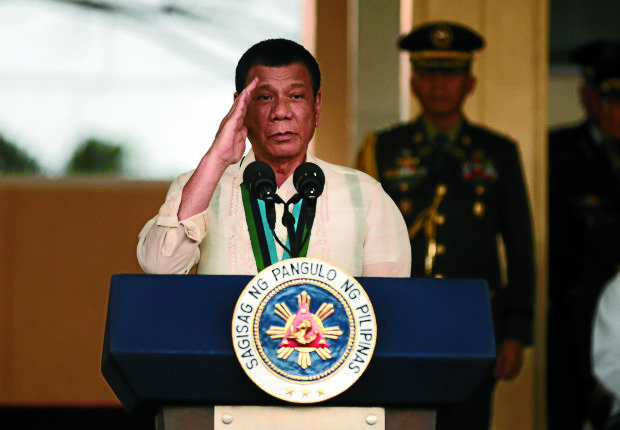  President Rodrigo Duterte salutes the troops during the 81st anniversary of the Armed Forces at Camp Aguinaldo on Wednesday, December 21, 2016. INQUIRER PHOTO / GRIG C. MONTEGRANDE