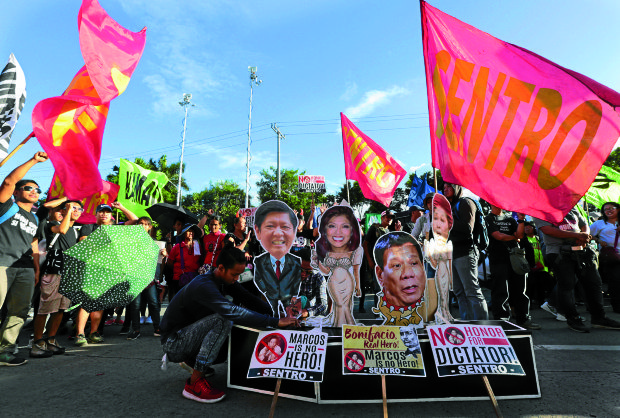  Protesters shout anti-marcos slogan at the protest rally against Marcos burial at the Libingan ng mga Bayani at the People Power Monument in Quezon City on Wedensday, November 30, 2016. INQUIRER PHOTO / GRIG C. MONTEGRANDE