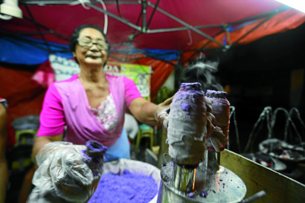 USUAL FARE “Puto bumbong” and other native delicacies are traditionally sold outside churches during the “simbang gabi.”      FILE PHOTO