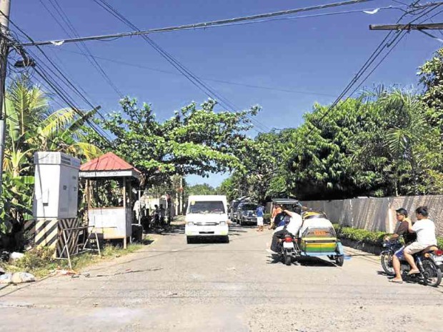 The main road in the village of Pogo Grande in Dagupan City is quiet on New Year’s Day 