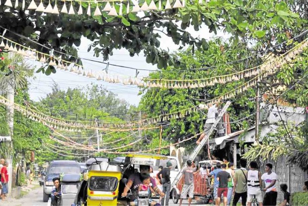 a stark contrast to the festive and noisy celebration last year when firecrackers, strung and put up like buntings, are lighted during a community event at noon.  —VENUS SARMIENTO/ CONTRIBUTOR AND WILLIE LOMIBAO