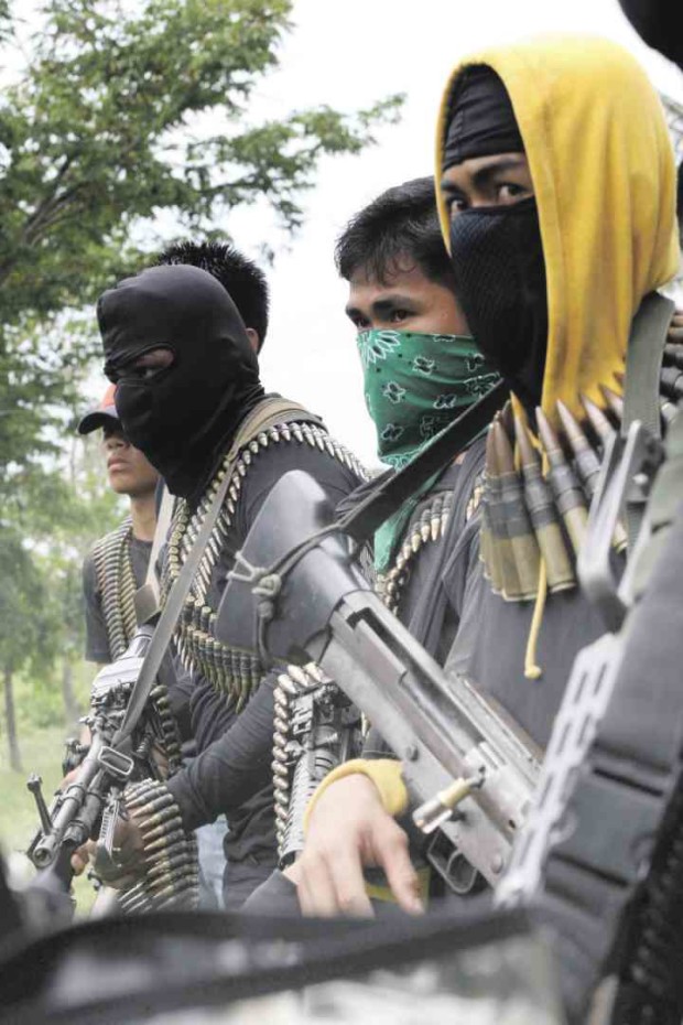 DARING RESCUE Members of the Bangsamoro Islamic Freedom Fighters, some of them shown in this 2012 photo, staged a daring raid on the North Cotabato District Jail in Kidapawan City before dawn onWednesday, killing a guard and freeing 158 inmates. —JEOFFREY MAITEM