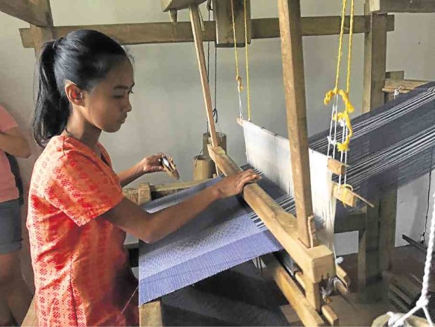 Arabela Gampong, at 13, is among the young weavers of Pinili town. —PHOTOS BY  LEILANIE ADRIANO  AND ALARIC YANOS/CONTRIBUTOR 
