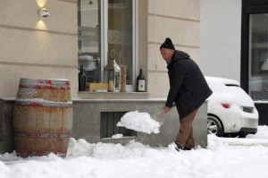 Man shovels snow in Munich in Germany - 8 Jan 2017