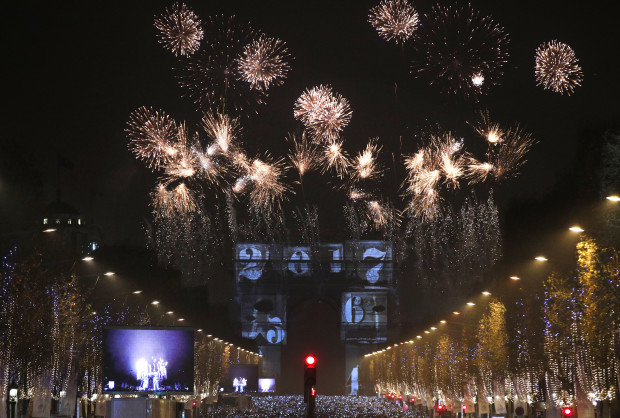 The 2017 appears during a firework over the Arc de Triomphe as part of the New Year celebrations on the Champs Elysees, in Paris, France, Sunday, Jan.1, 2017. (AP Photo/Christophe Ena)
