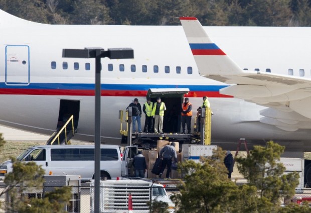 A Russian aircraft is loaded with cargo at Dulles International Airport December 31, 2016, in Sterling, Virginia, just outside Washington, DC. The special flight arrived to pickup Russian diplomats expelled by US President Barack Obama as part of sanctions imposed on Russia for suspected cyberattacks during the US election. / AFP PHOTO / PAUL J. RICHARDS