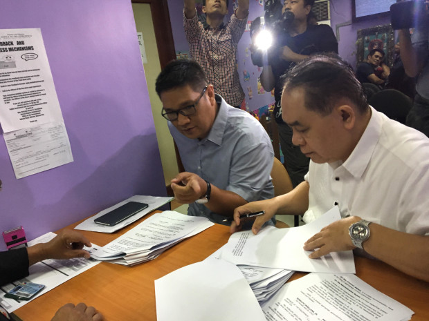 United Filipino Consumers and Commuters president RJ Javellana and Airboard Company managing partner Manuel Galvez file a complaint against Environment Secretary Gina Lopez at the Office of the Ombudsman on Jan. 10, 2017, for allegedly whitewashing irregularities in the government's air quality monitoring contract. (PHOTO BY VINCE NONATO / INQUIRER) 