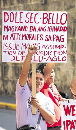 Some drivers of DLTB, allied with a labor group claiming to represent all DLTB workers, vent their ire on Labor Secretary Silvestre Bello III during a rally on Jan. 3. —LYN RILLON