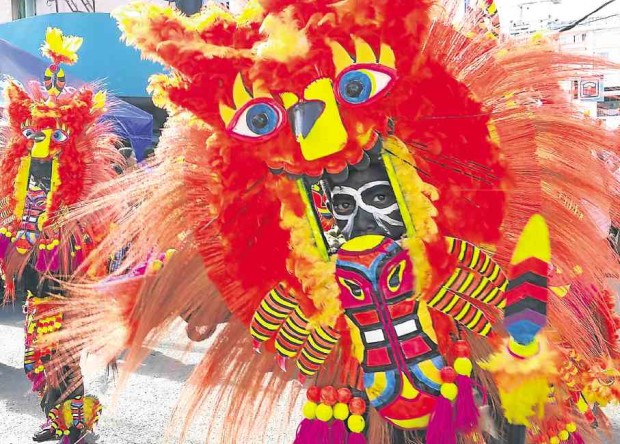 In the Aklan capital, Kalibo, the streets burst with colors as Ati-Atihan participants wear all sorts of costumes. —NESTOR P. BURGOS JR.
