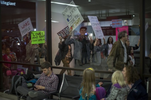 LOS ANGELES, CA - FEBRUARY 04: Demonstrators march in support of a ruling by a federal judge in Seattle that grants a nationwide temporary restraining order against the presidential order to ban travel to the United States from seven Muslim-majority countries, inside the Tom Bradley International Terminal at Los Angeles International Airport on February 4, 2017 in Los Angeles, California.   David McNew/Getty Images/AFP