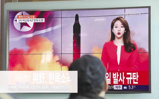 CHALLENGE TO TRUMP  North Korea fires a ballistic missile in this footage shown in Seoul on Sunday in a provocation to test the response of US President Donald Trump. —AP