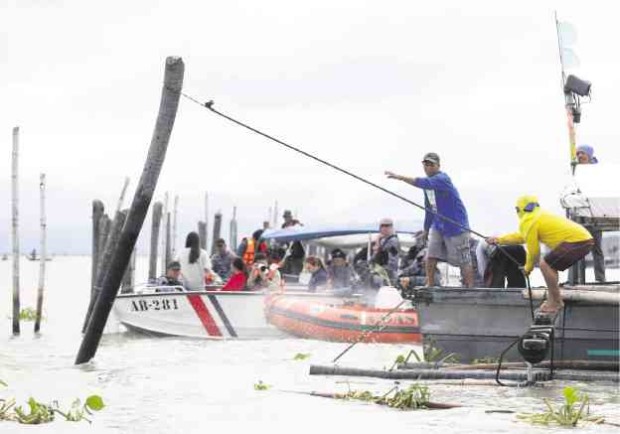 Small fishermen will regain access to their traditional fishing ground in Laguna de Bay once the government clears the lake of fish pens and other structures. —LYN RILLON