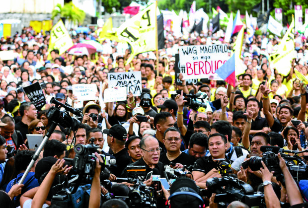 Former Pres. Benigno S. Aquino III on the 31st anniversary of EDSA People Power revolution held beside the at the People Power Monument. INQUIRER PHOTO/LYN RILLON