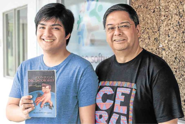 INSPIREDRenewed interest in martial law inspired Joey Gurango (right), with son JC, to relaunch Mijares’ book. —Leo M. Sabangan II