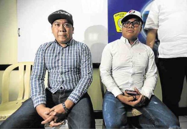 Alvin San Pablo (left), who reportedly drove the Hummer vehicle that hit and killed two motorcycle riders in Quezon City on Feb. 12, 2017,  presented himself to the police. LYN RILLON / INQUIRER FILES