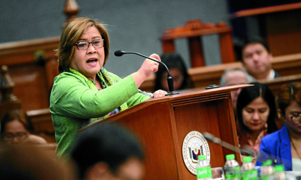Sen. Leila M. de Lima questions former BI Commissioners Al Argosino and Michael Robles how they kept as evidence the P30-million bribe money they allegedly received from casino mogul Jack Lam's middle man, former policeman Wally Sombero. She noted the discrepancy in the stash of money they surrendered to the authorities and the ones they showed to the media. (Photo: Joseph Vidal/Prib)