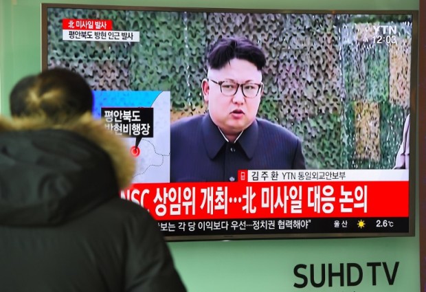 A man watches the news showing file footage of North Korean leader Kim Jong-Un at a railway station in Seoul on February 12, 2017. North Korea fired a ballistic missile on February 12 in an apparent provocation to test the response from new US President Donald Trump, the South Korean defence ministry said. / AFP PHOTO / JUNG Yeon-Je
