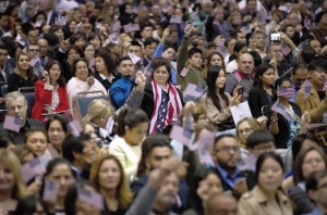 People wave American flags at naturalization rite - 15 Feb 2017