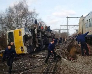 Police officers stand beside derailed train in Belgium - 18 Feb 2017