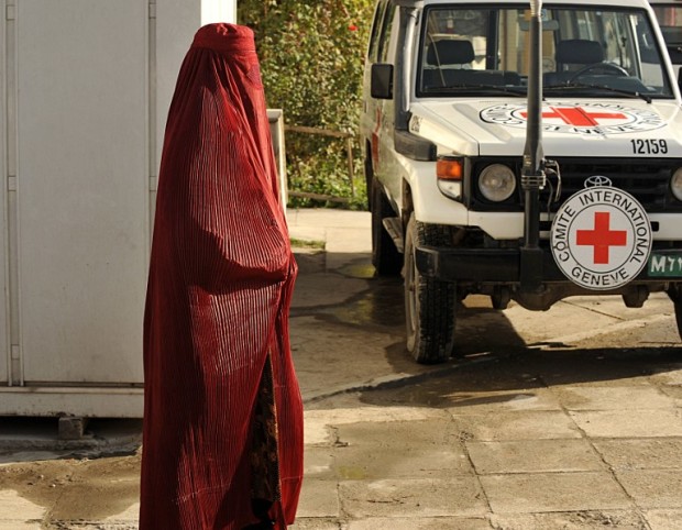 (FILES) In this photograph taken on September 23, 2008, an Afghan pedestrain walks past a vehicle at the International Committee for the Red Cross (ICRC) office in Kabul. Six Red Cross workers were killed and two others were missing in northern Afghanistan, the international charity said February 8, underscoring the growing dangers faced by aid workers in the war-battered country. The aid workers were killed in the volatile province of Jowzjan, the charity added, without revealing their nationalities or who was behind the incident.   / AFP PHOTO / SHAH MARAI