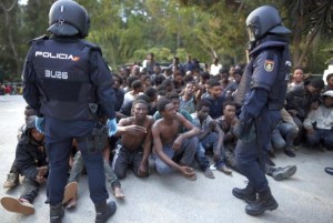 Spanish police officers detain migrants from Morocco - 17 Feb 2017
