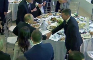 Vladimir Putin shakes hands with Michael Flynn - 10 Dec 2015