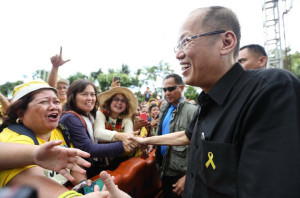 Former Pres. Benigno S. Aquino III greets some crowd members who came for the EDSA 31st anniversary held beside the People Power Monument. Inquirer/Lyn Rillon